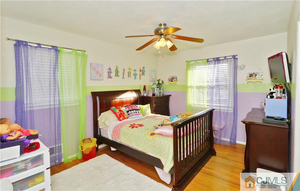 64 Valley Road Jackson, NJ 08527 - Photo 15 of 24 a bedroom with a bed and wooden floor