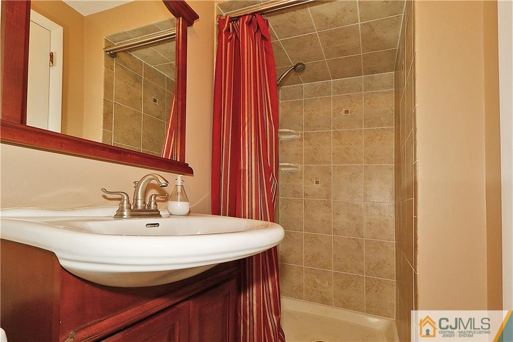 64 Valley Road Jackson, NJ 08527 - Photo 20 of 24 a bathroom with a sink and a mirror