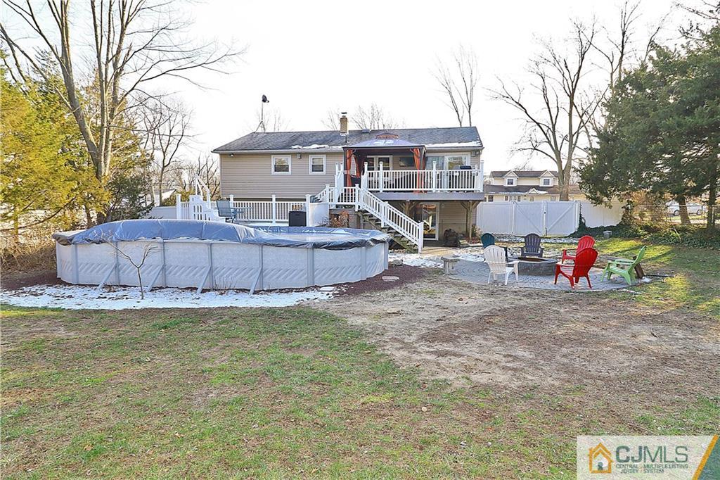 64 Valley Road Jackson, NJ 08527 - Photo 23 of 24 a view of a house with a big yard and large tree