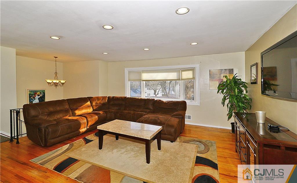 64 Valley Road Jackson, NJ 08527 - Photo 4 of 24 a living room with furniture and a flat screen tv