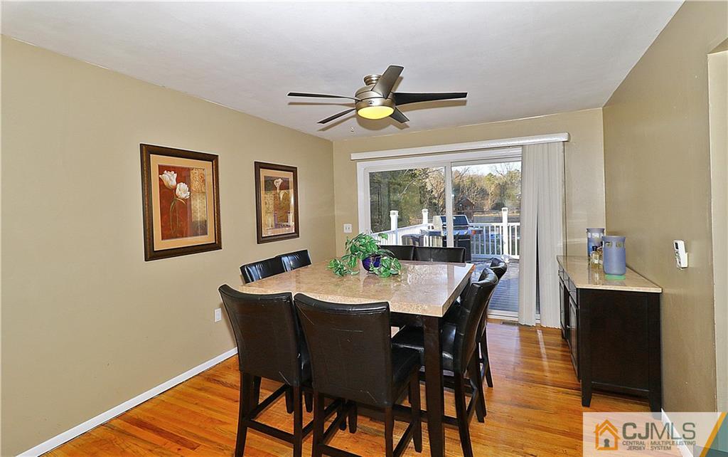 64 Valley Road Jackson, NJ 08527 - Photo 7 of 24 a dining room with furniture a window and wooden floor
