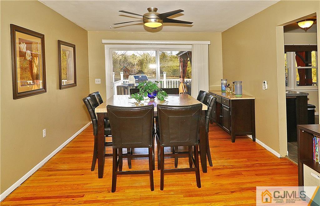 64 Valley Road Jackson, NJ 08527 - Photo 8 of 24 a dining room with furniture a rug and wooden floor