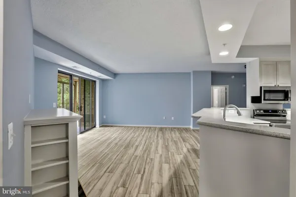 a view of a kitchen from the hallway