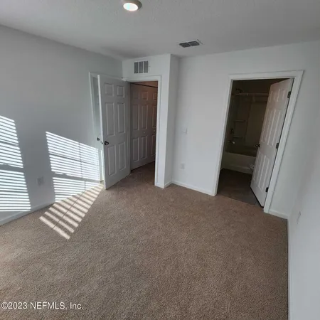 a view of room with staircase and closet