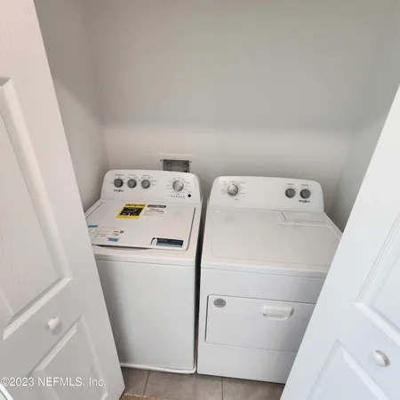 a utility room with dryer and washer