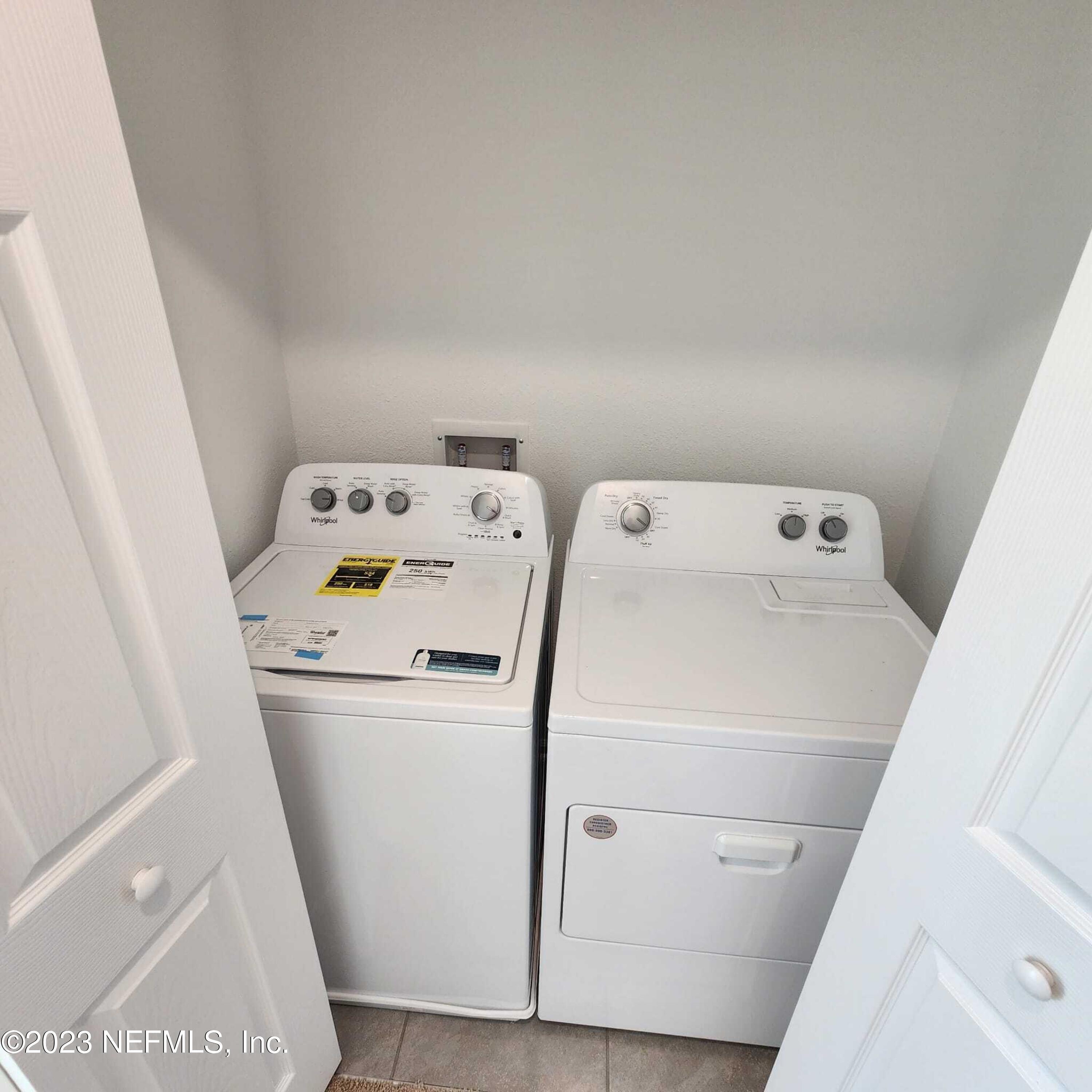 8409 Zenith Circle Jacksonville, FL 32256 - Photo 17 of 23 a utility room with dryer and washer