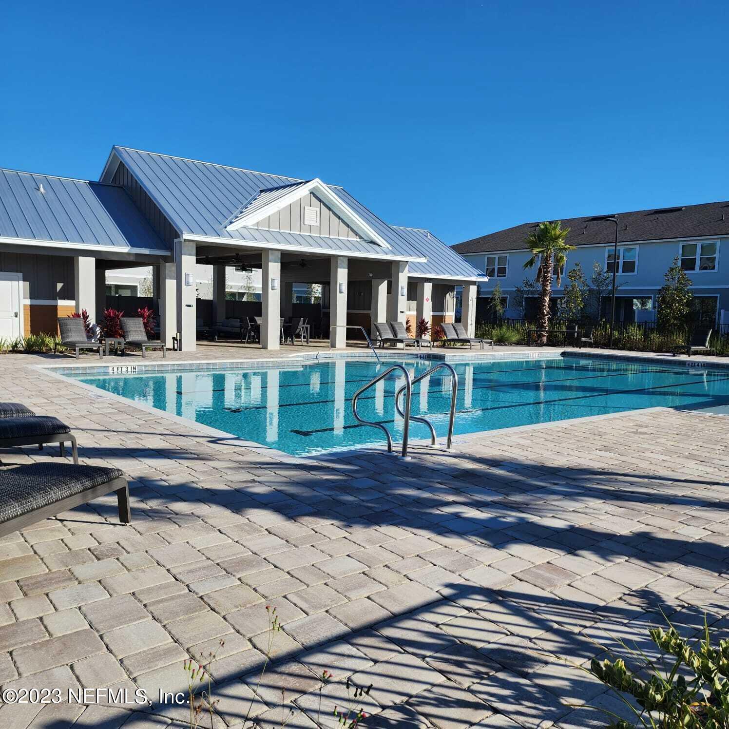 8409 Zenith Circle Jacksonville, FL 32256 - Photo 18 of 23 a front view of a house with a yard
