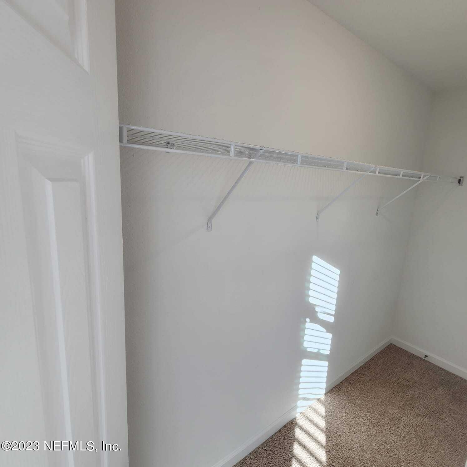 8409 Zenith Circle Jacksonville, FL 32256 - Photo 20 of 23 a view of an empty walk in closet
