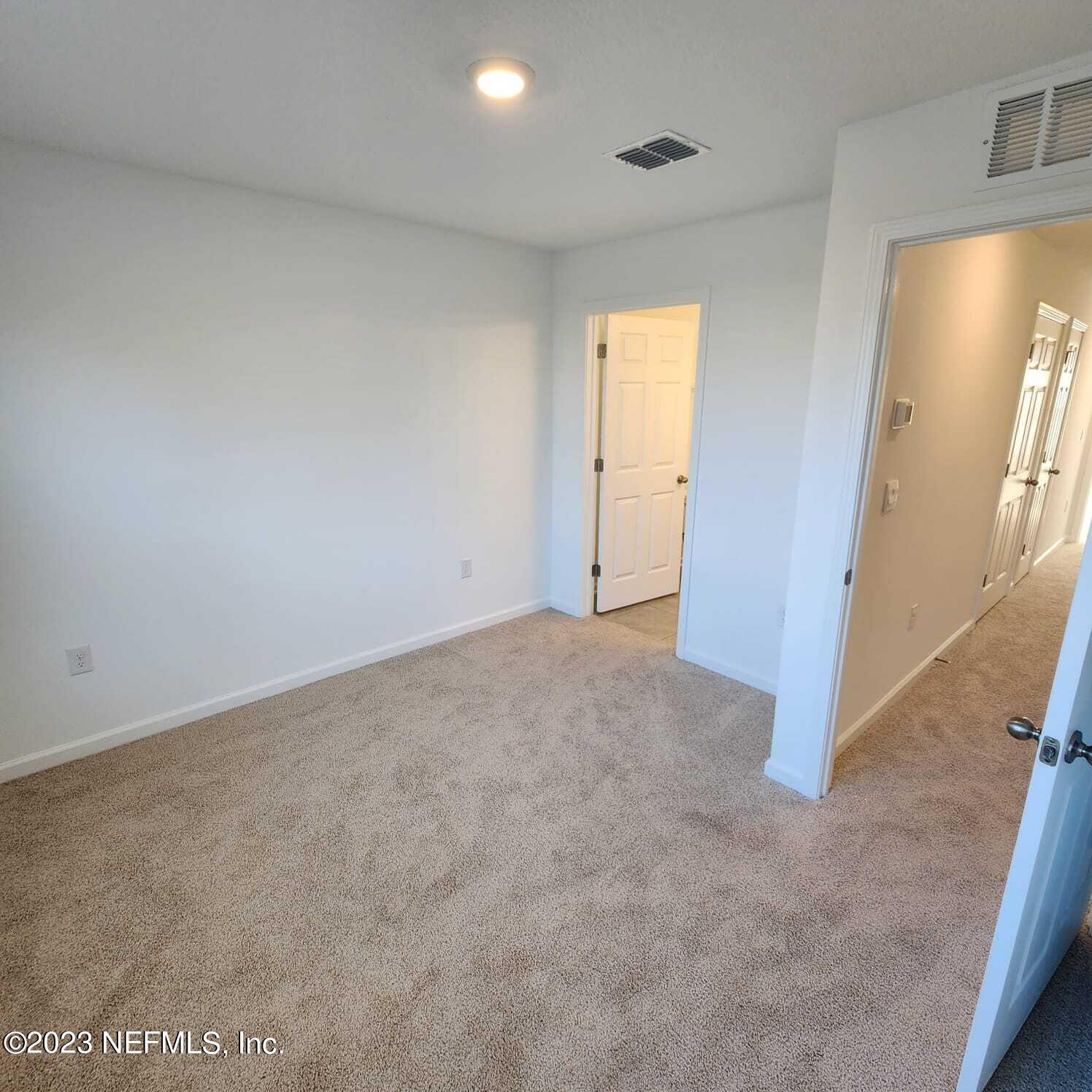 8409 Zenith Circle Jacksonville, FL 32256 - Photo 21 of 23 a view of an empty room with a window