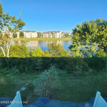 a view of a lake with a big yard