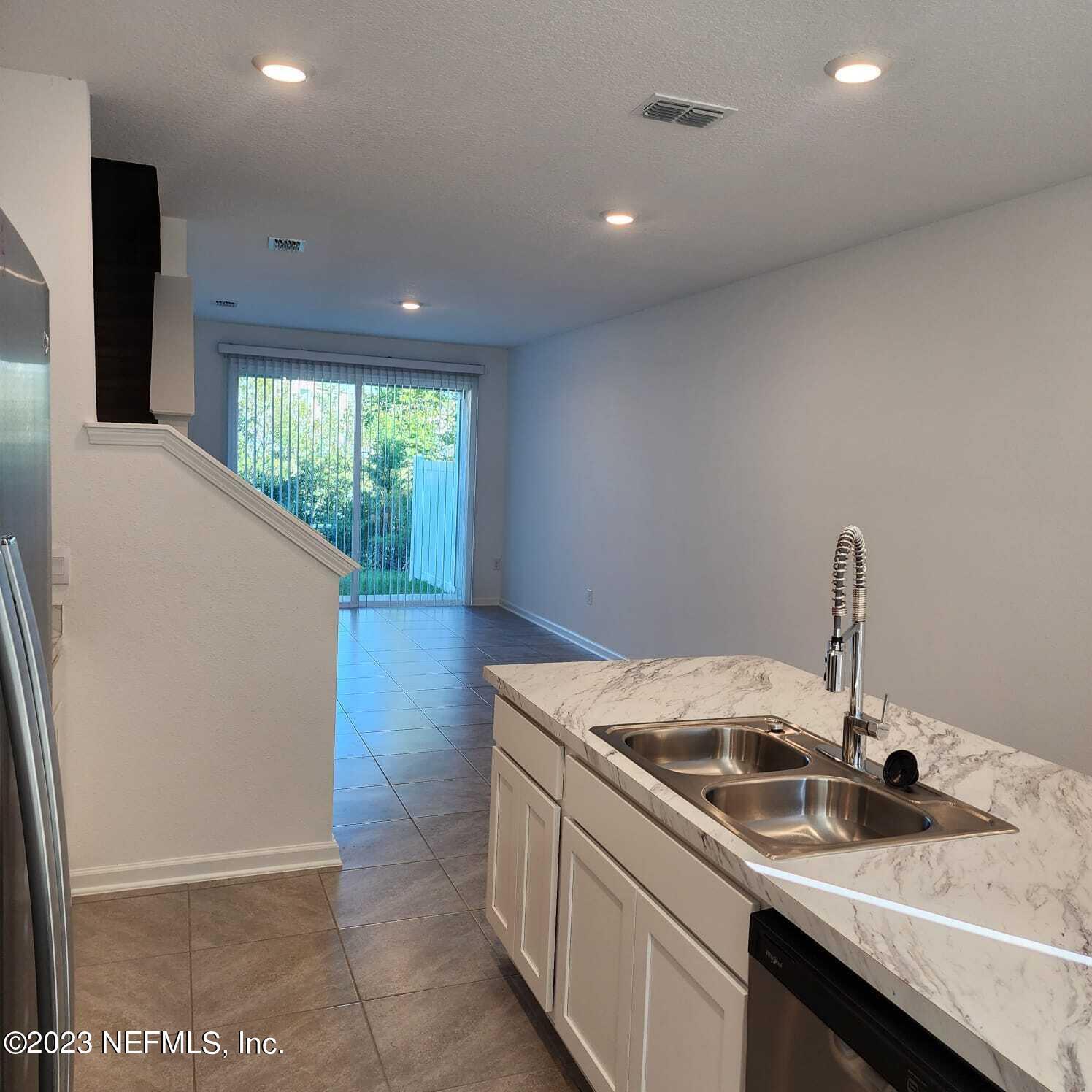 8409 Zenith Circle Jacksonville, FL 32256 - Photo 3 of 23 a kitchen with a sink and washing machine