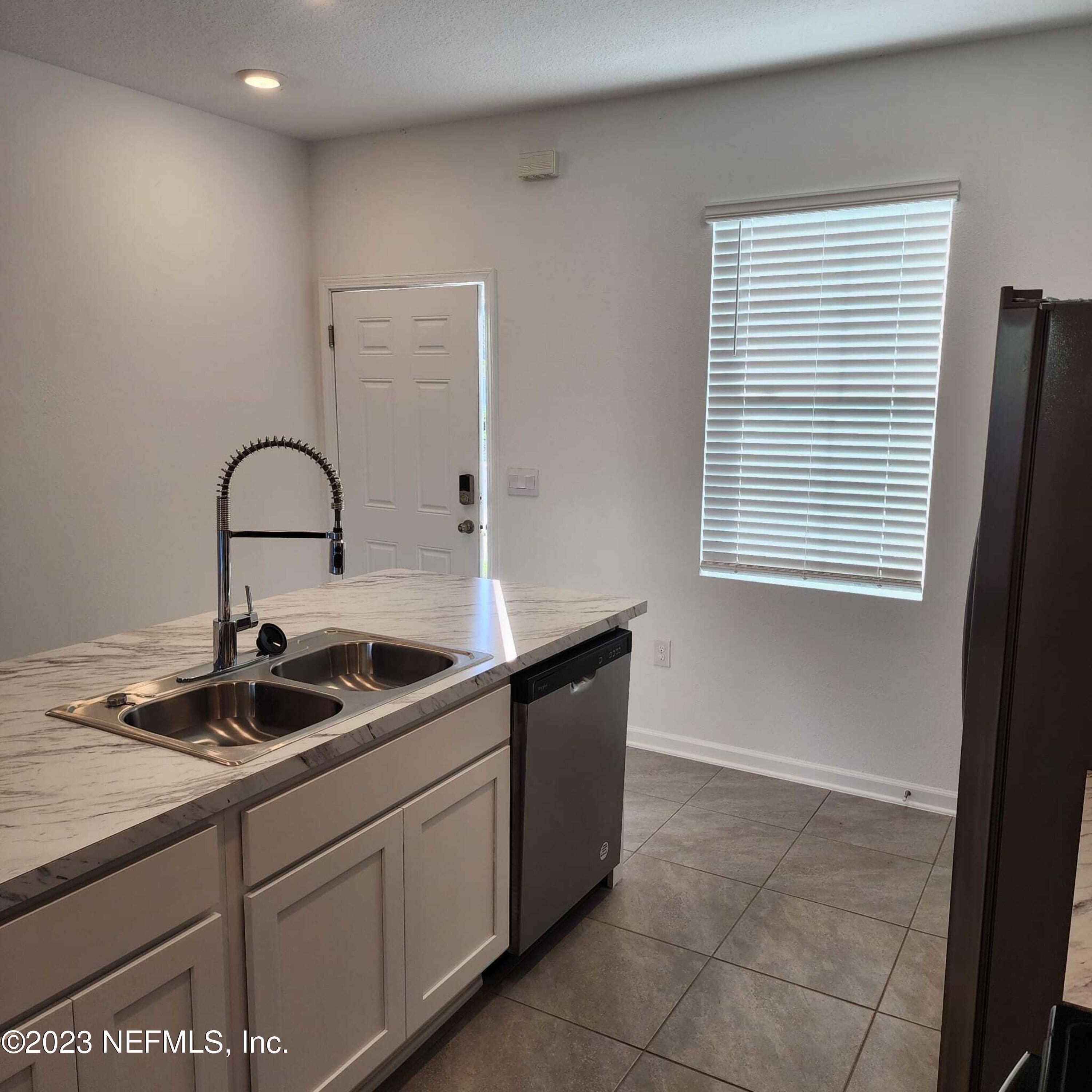 8409 Zenith Circle Jacksonville, FL 32256 - Photo 6 of 23 a kitchen with a sink and cabinets