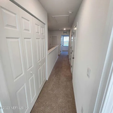 a view of a hallway with a entryway