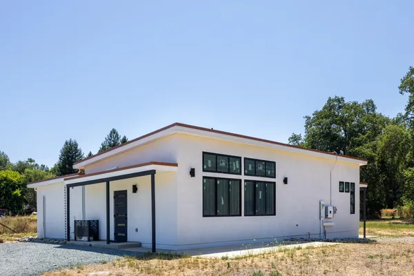 a front view of a house with garage
