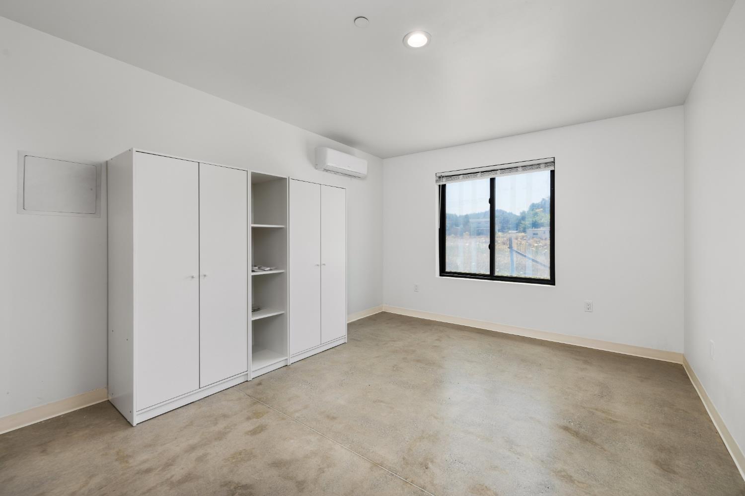 18093 Lasso Loop, Unit B Penn Valley, CA 95946 - Photo 15 of 26 an empty room with a empty space and windows