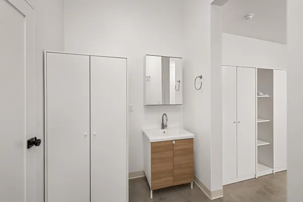 a bathroom with a sink and a mirror
