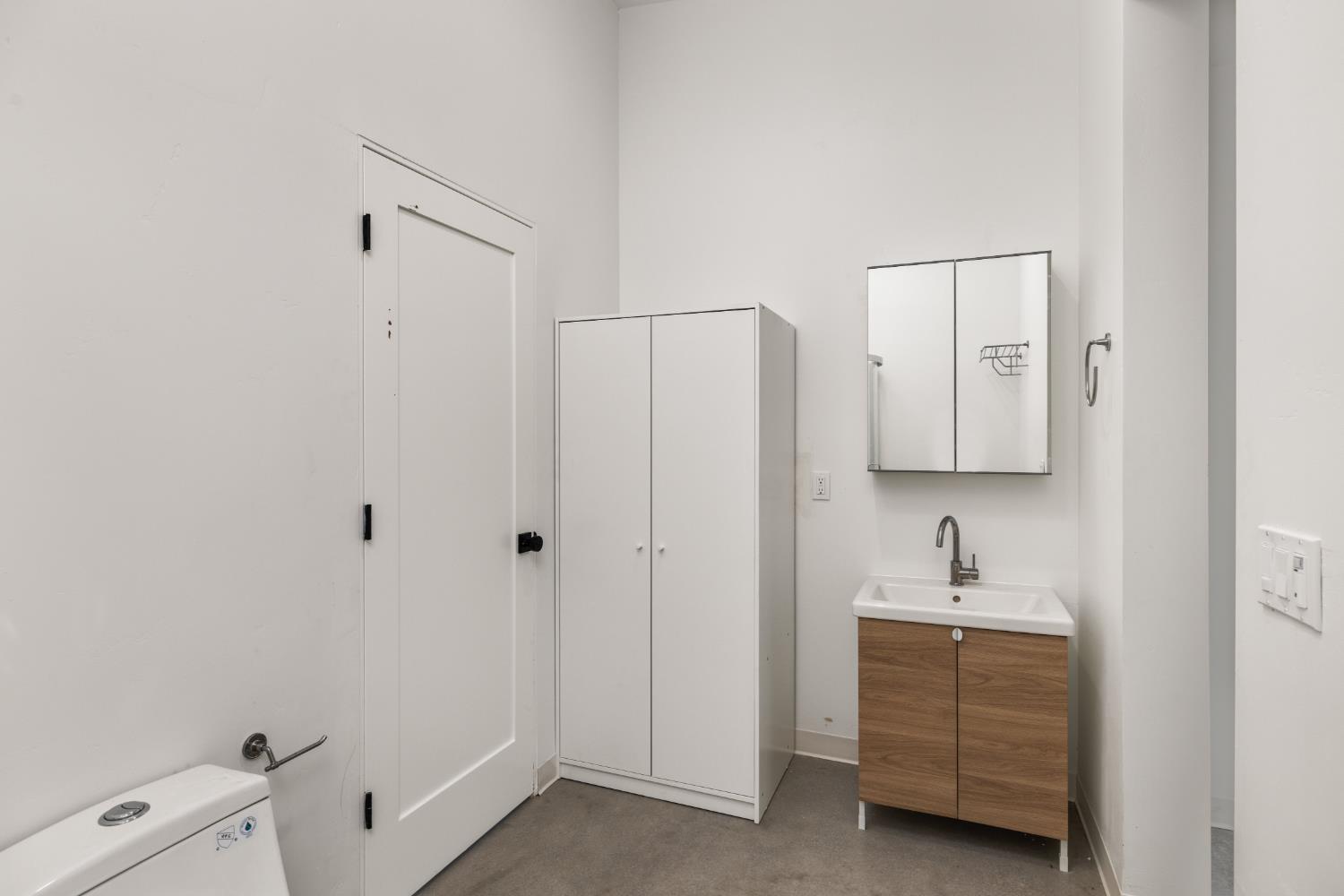 18093 Lasso Loop, Unit B Penn Valley, CA 95946 - Photo 21 of 26 a bathroom with a sink and a mirror
