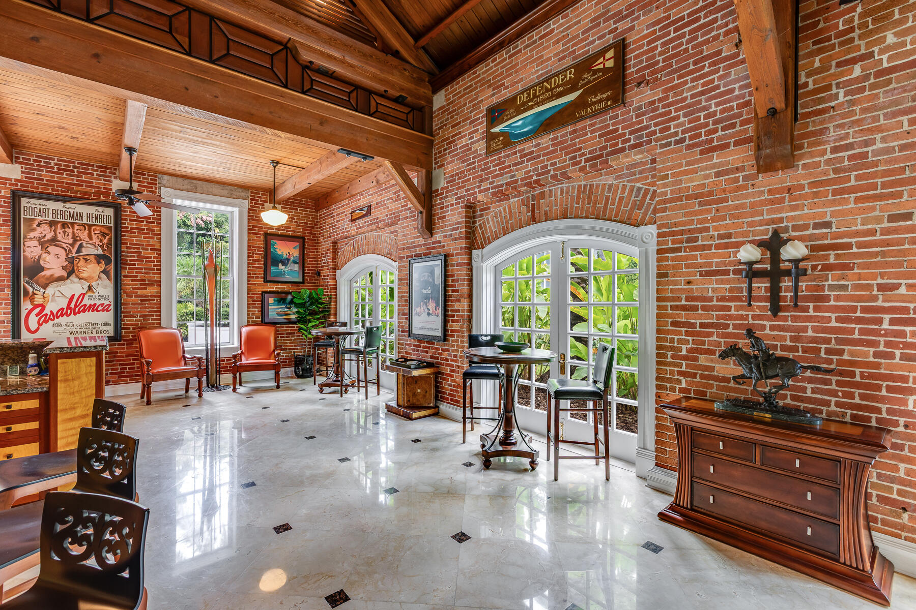 103 Front Street Key West, FL 33040 - Photo 12 of 44 a living room with furniture a fireplace and windows