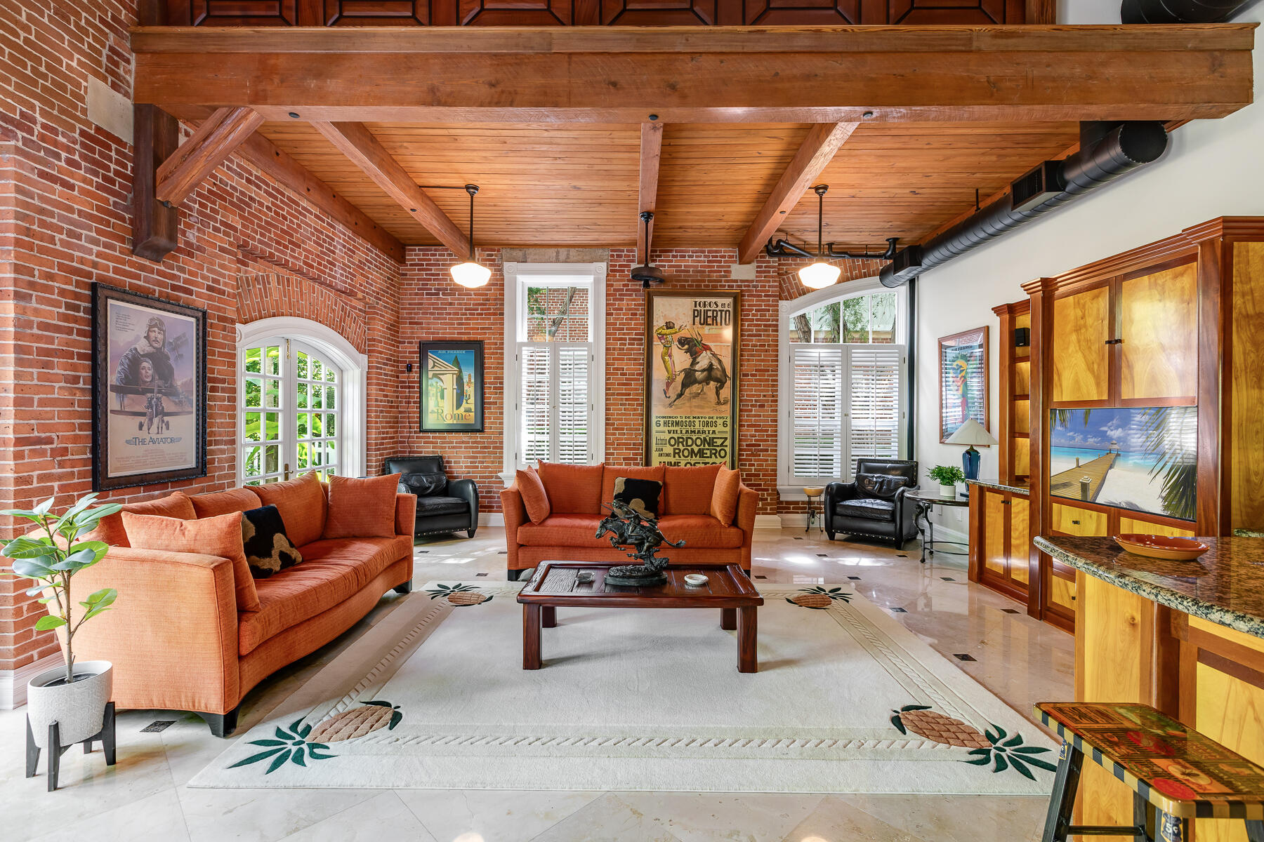 103 Front Street Key West, FL 33040 - Photo 16 of 44 a living room with furniture a flat screen tv and a large window