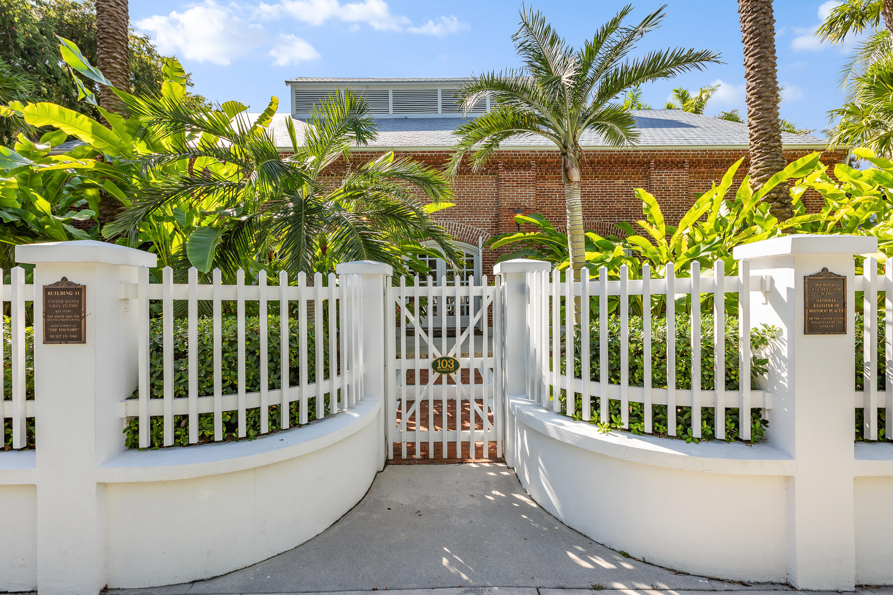 103 Front Street Key West, FL 33040 - Photo 2 of 44 a view of a house with a small yard and plants