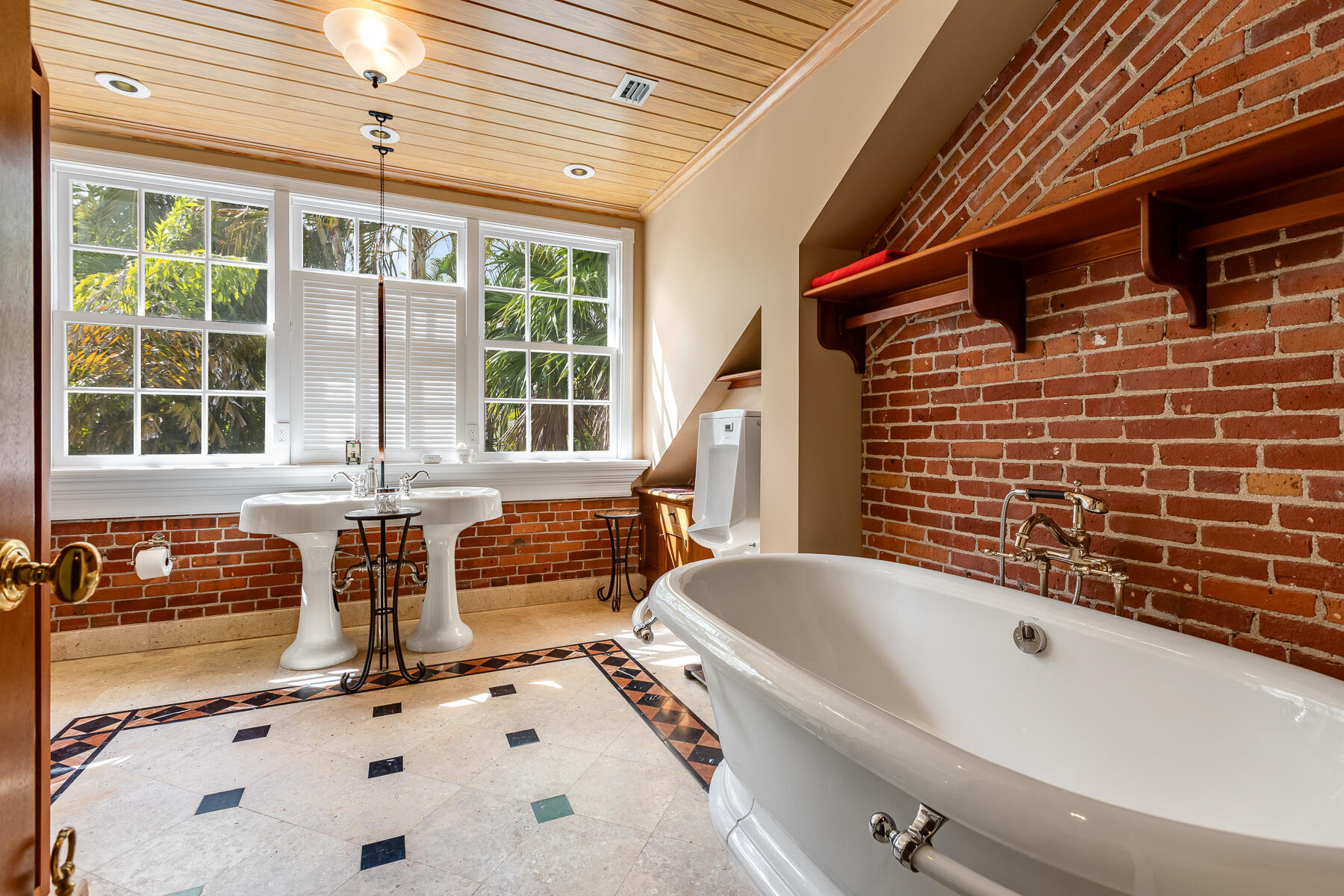 103 Front Street Key West, FL 33040 - Photo 26 of 44 a bathroom with a tub sink and mirror