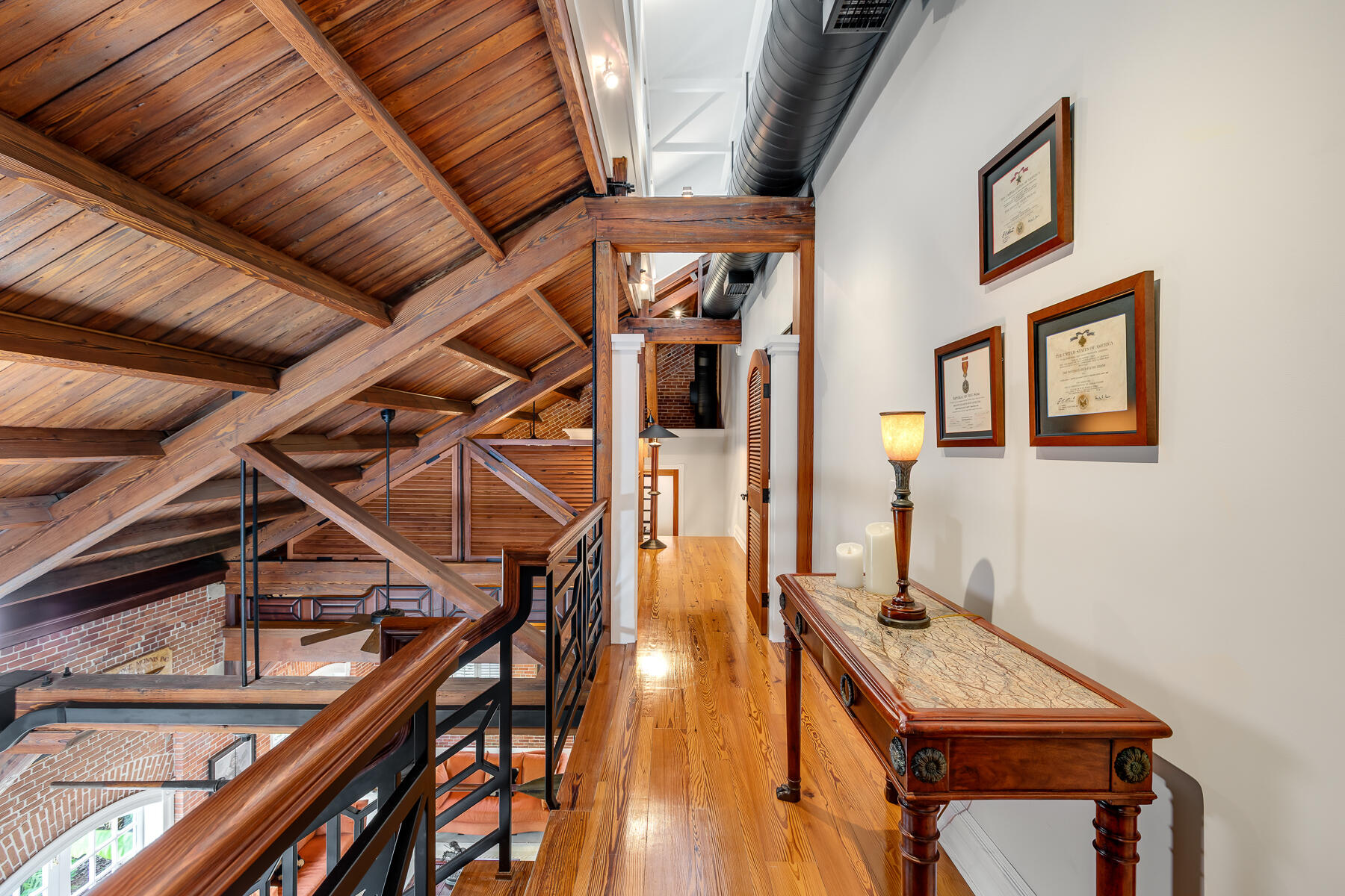 103 Front Street Key West, FL 33040 - Photo 28 of 44 a view of a balcony with furniture and wooden floor