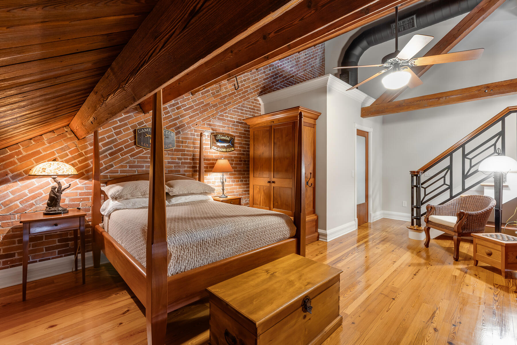 103 Front Street Key West, FL 33040 - Photo 30 of 44 a bedroom with bed and wooden floor