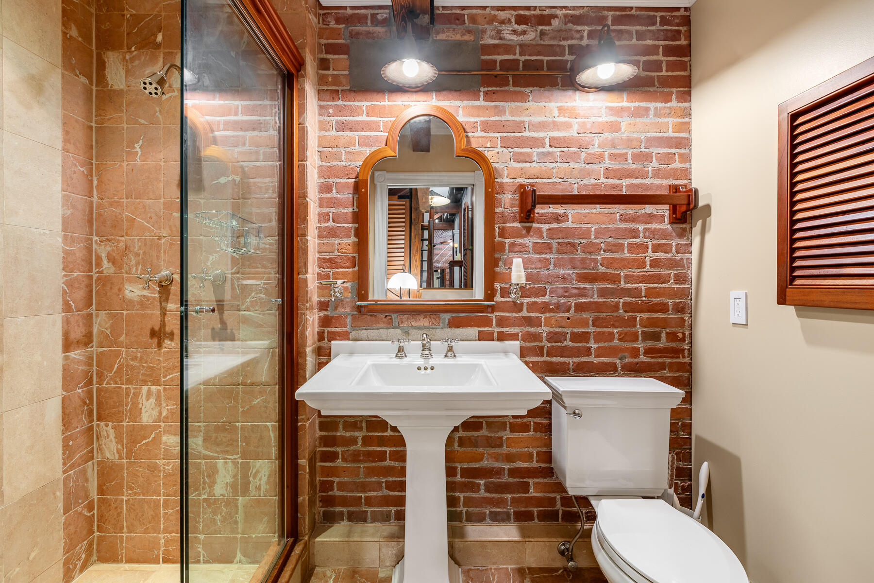 103 Front Street Key West, FL 33040 - Photo 31 of 44 a bathroom with a sink toilet and shower