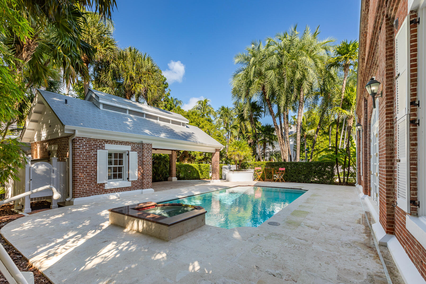 103 Front Street Key West, FL 33040 - Photo 37 of 44 a swimming pool with outdoor seating