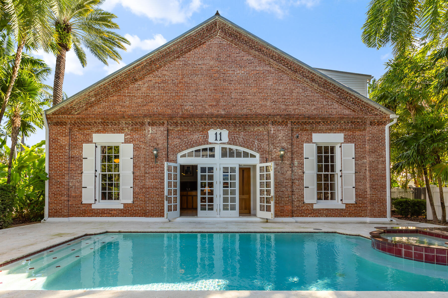 103 Front Street Key West, FL 33040 - Photo 40 of 44 a front view of a house with a yard
