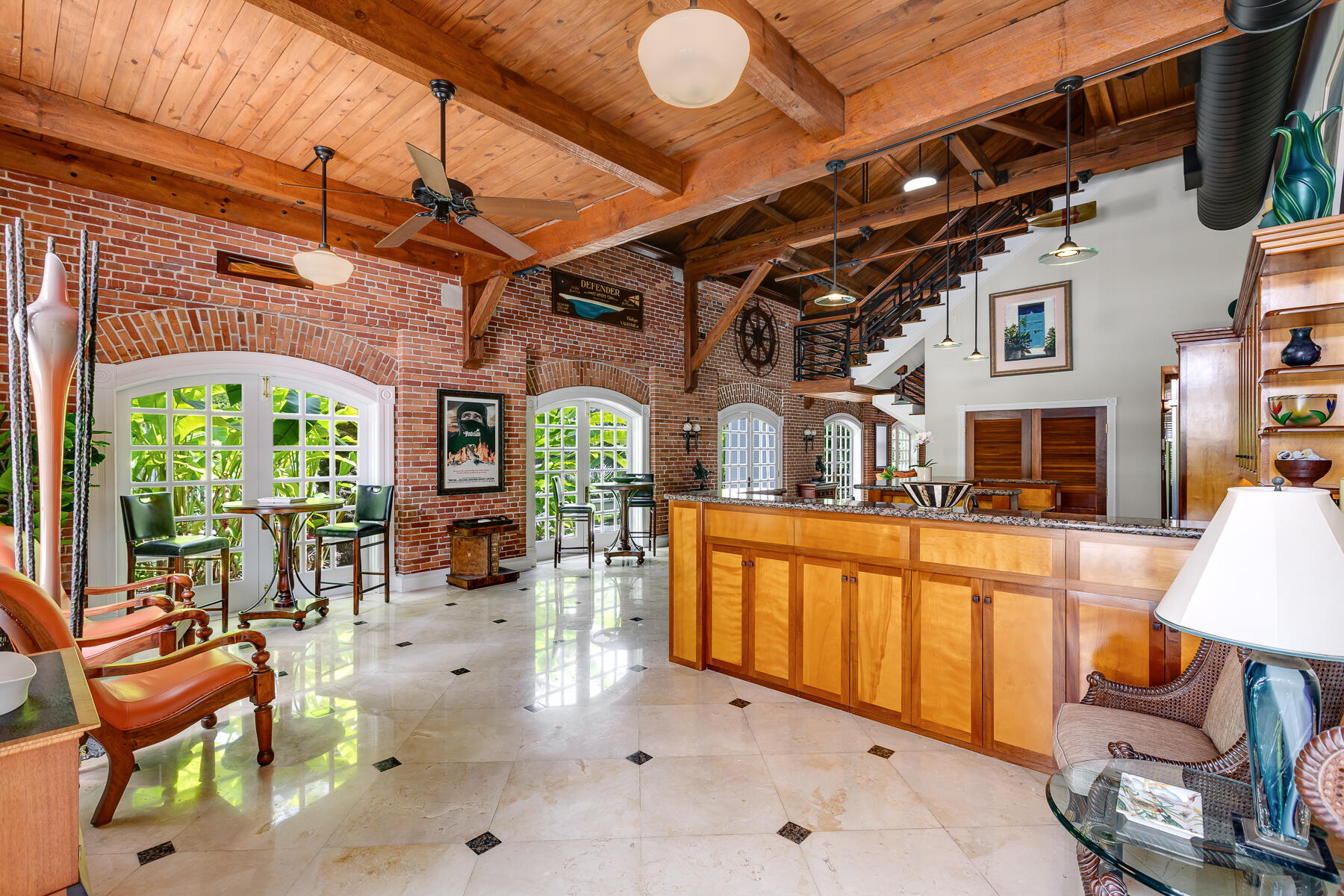 103 Front Street Key West, FL 33040 - Photo 5 of 44 a view of an chairs and tables in the patio