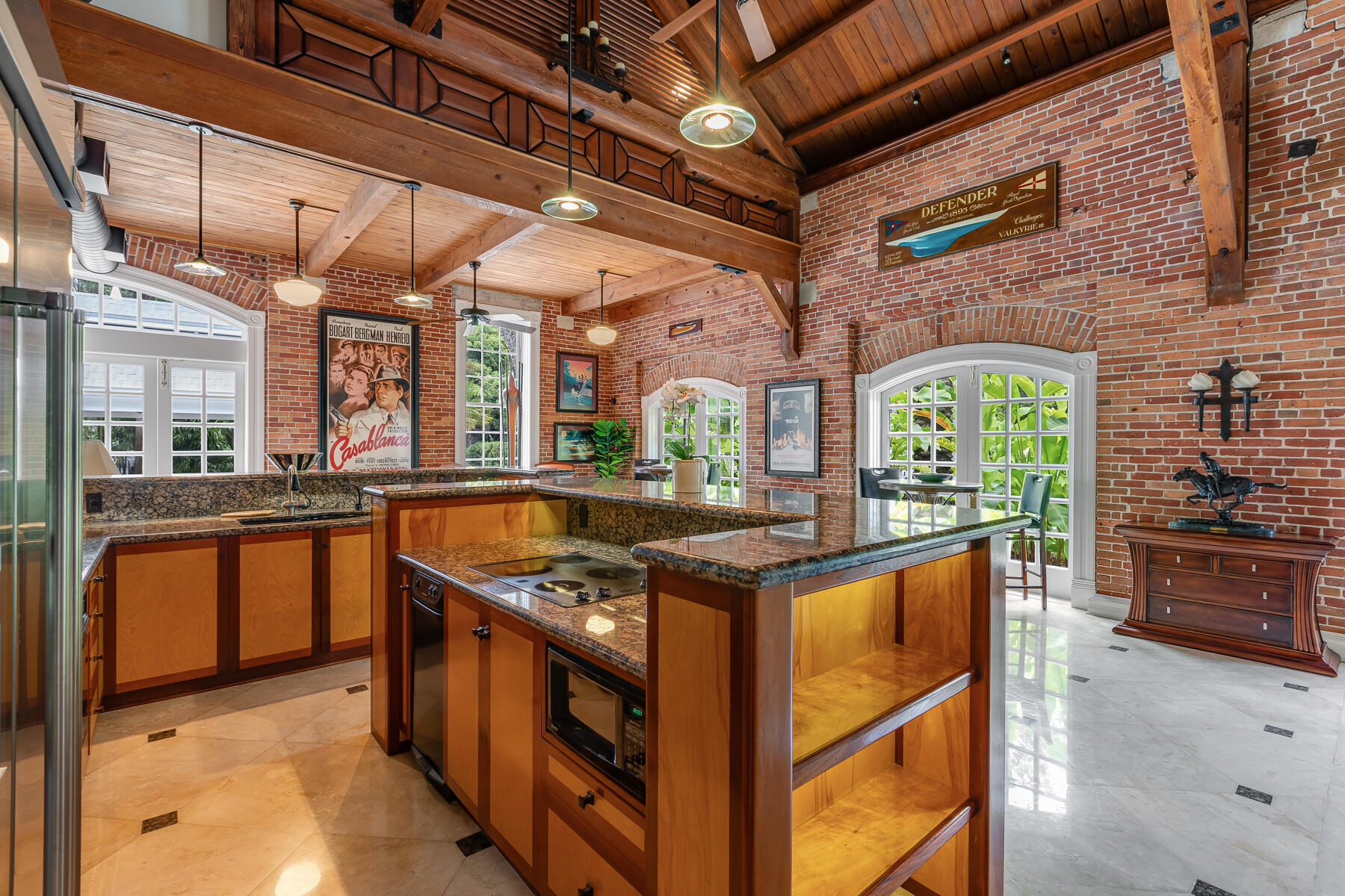 103 Front Street Key West, FL 33040 - Photo 8 of 44 a kitchen with stainless steel appliances granite countertop a stove and a sink