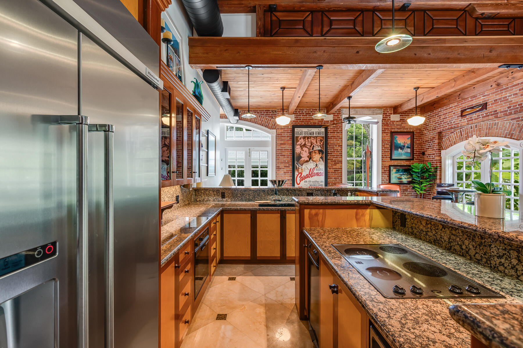 103 Front Street Key West, FL 33040 - Photo 9 of 44 a kitchen with stainless steel appliances granite countertop a sink a stove and a refrigerator