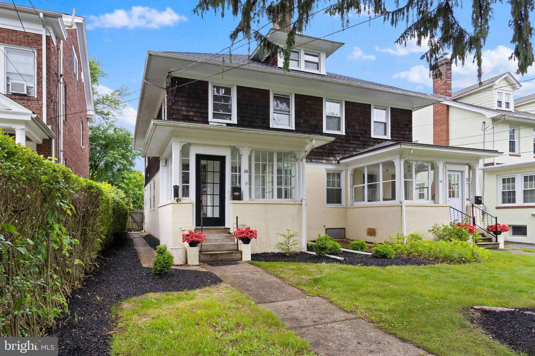 a front view of a house with garden