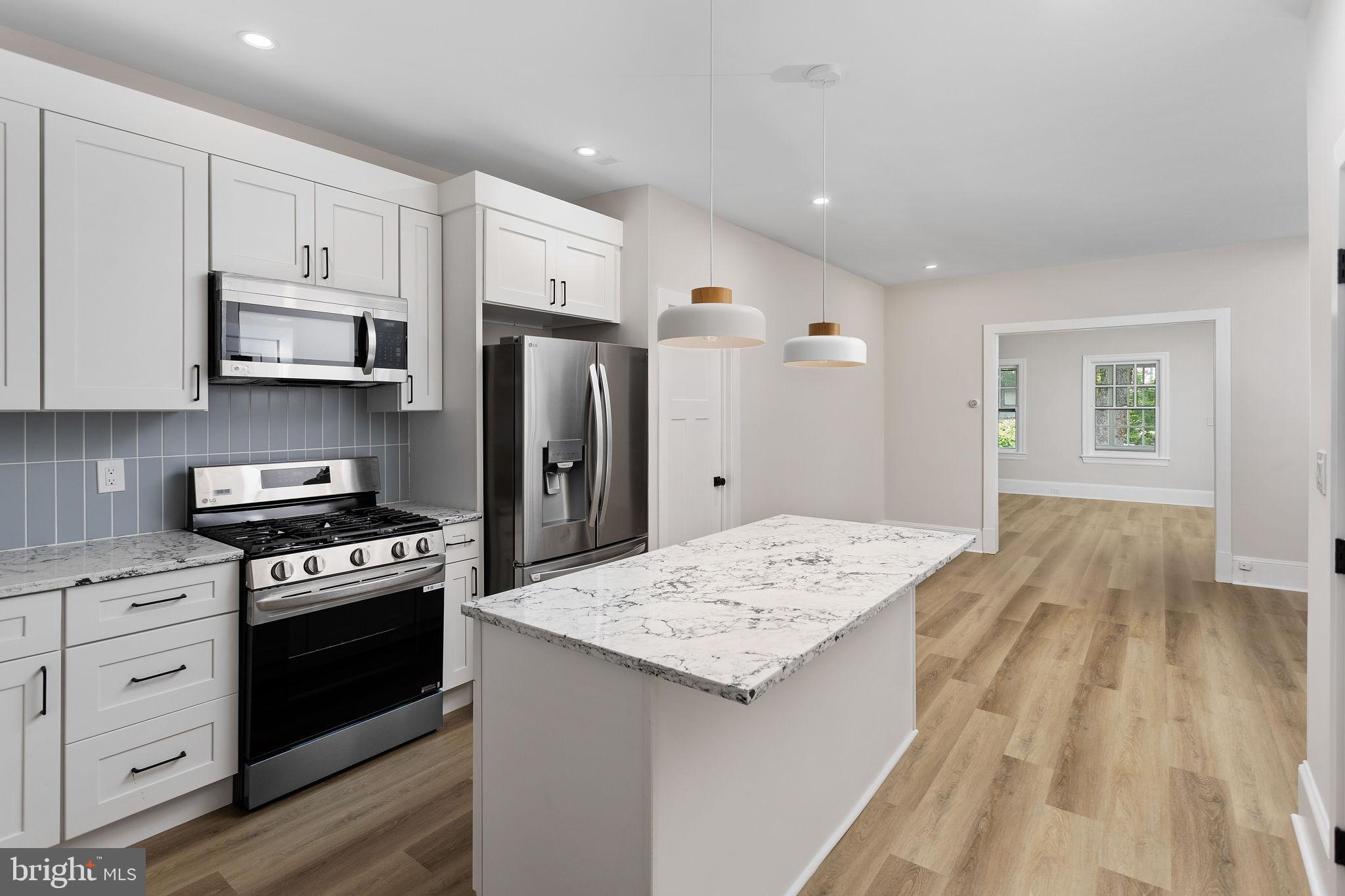 26 Jefferson Road Princeton, NJ 08540 - Photo 32 of 32 a kitchen with granite countertop a stove a sink and a refrigerator