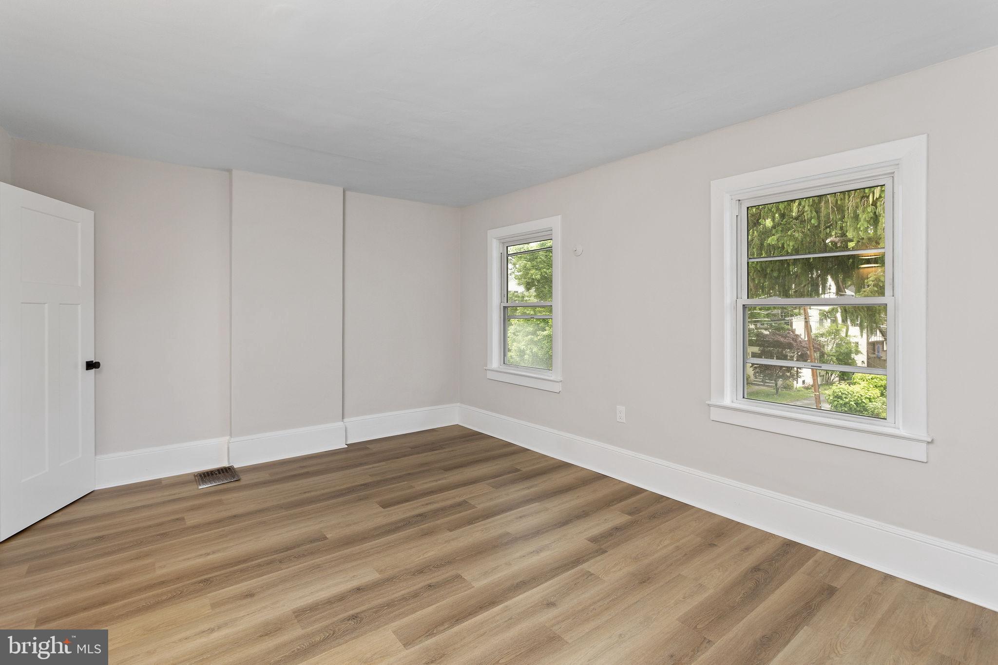 26 Jefferson Road Princeton, NJ 08540 - Photo 20 of 32 a view of an empty room with wooden floor and a window