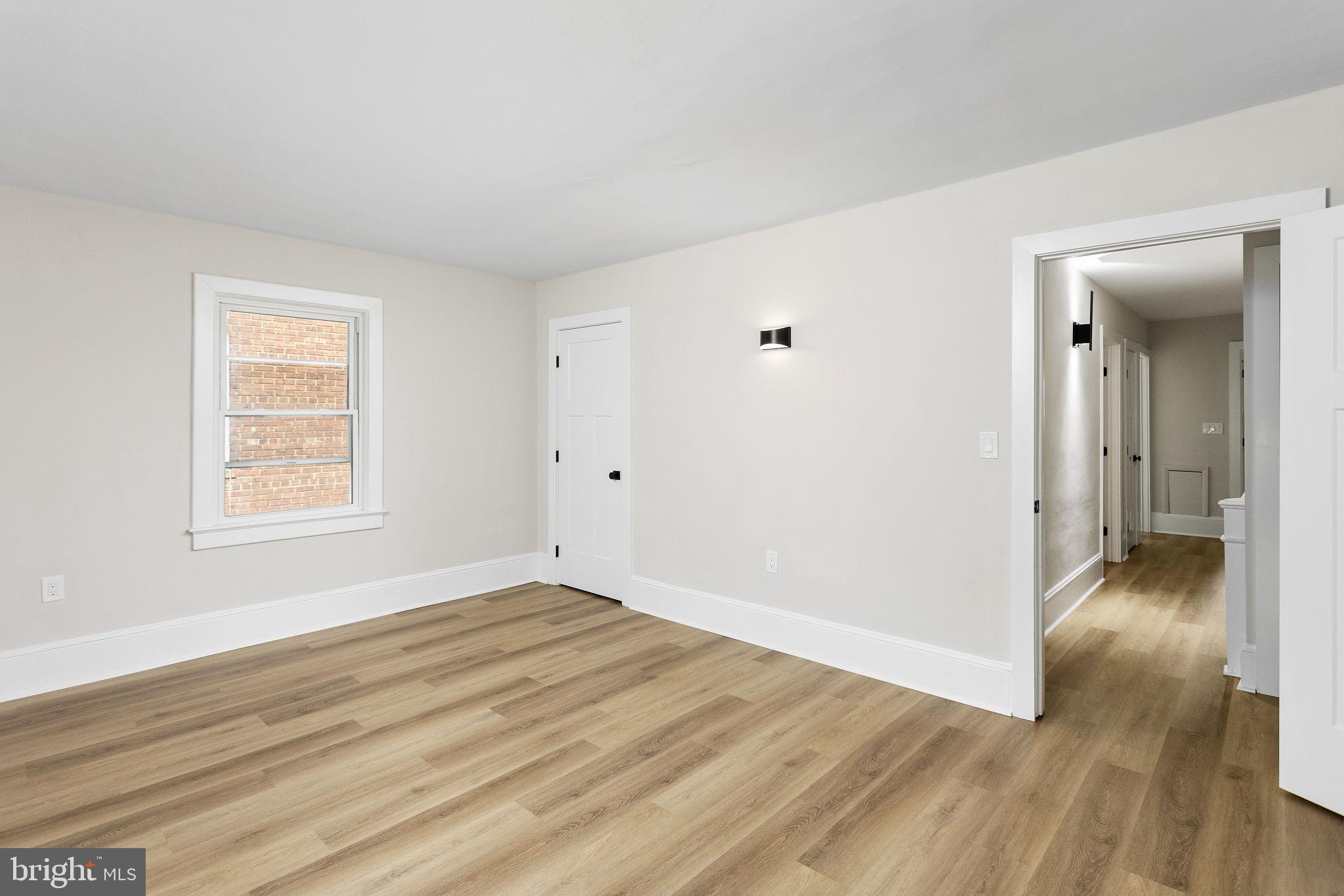 26 Jefferson Road Princeton, NJ 08540 - Photo 21 of 32 a view of an empty room with wooden floor and a window