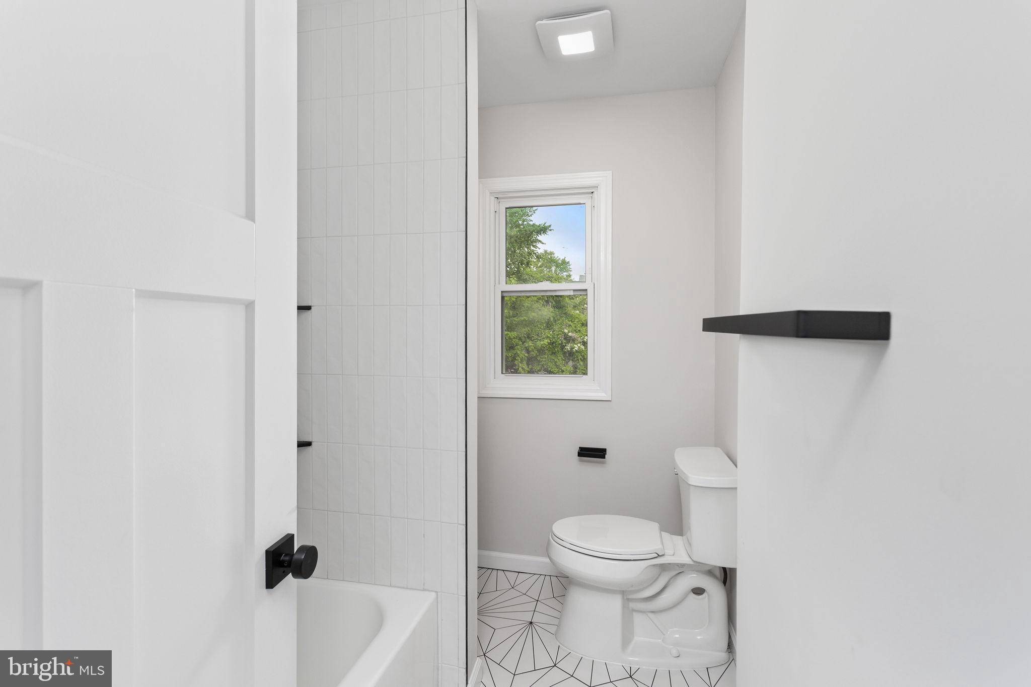 26 Jefferson Road Princeton, NJ 08540 - Photo 22 of 32 a bathroom with a toilet and a bath tub