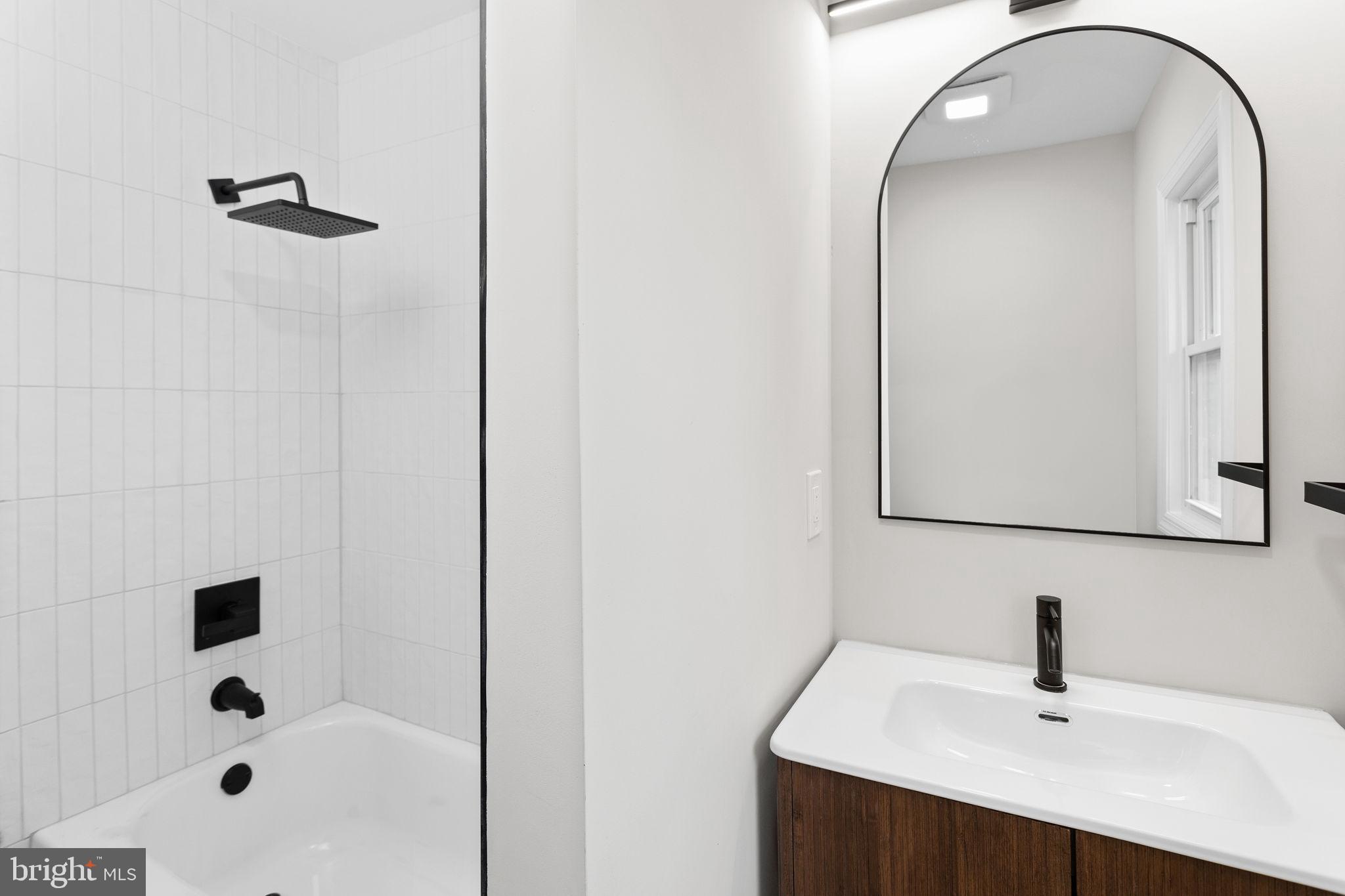 26 Jefferson Road Princeton, NJ 08540 - Photo 23 of 32 a bathroom with a sink a mirror and shower