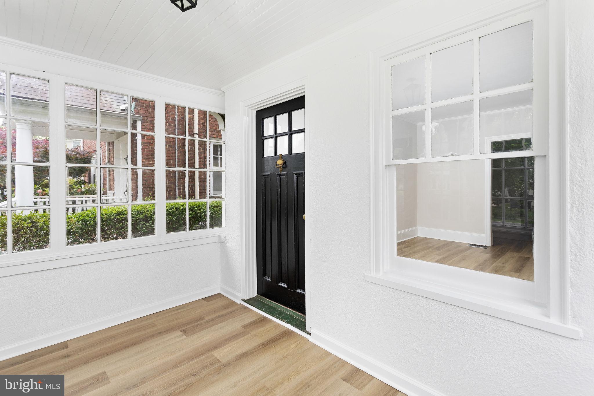 26 Jefferson Road Princeton, NJ 08540 - Photo 5 of 32 a view of an empty room with a window and wooden floor