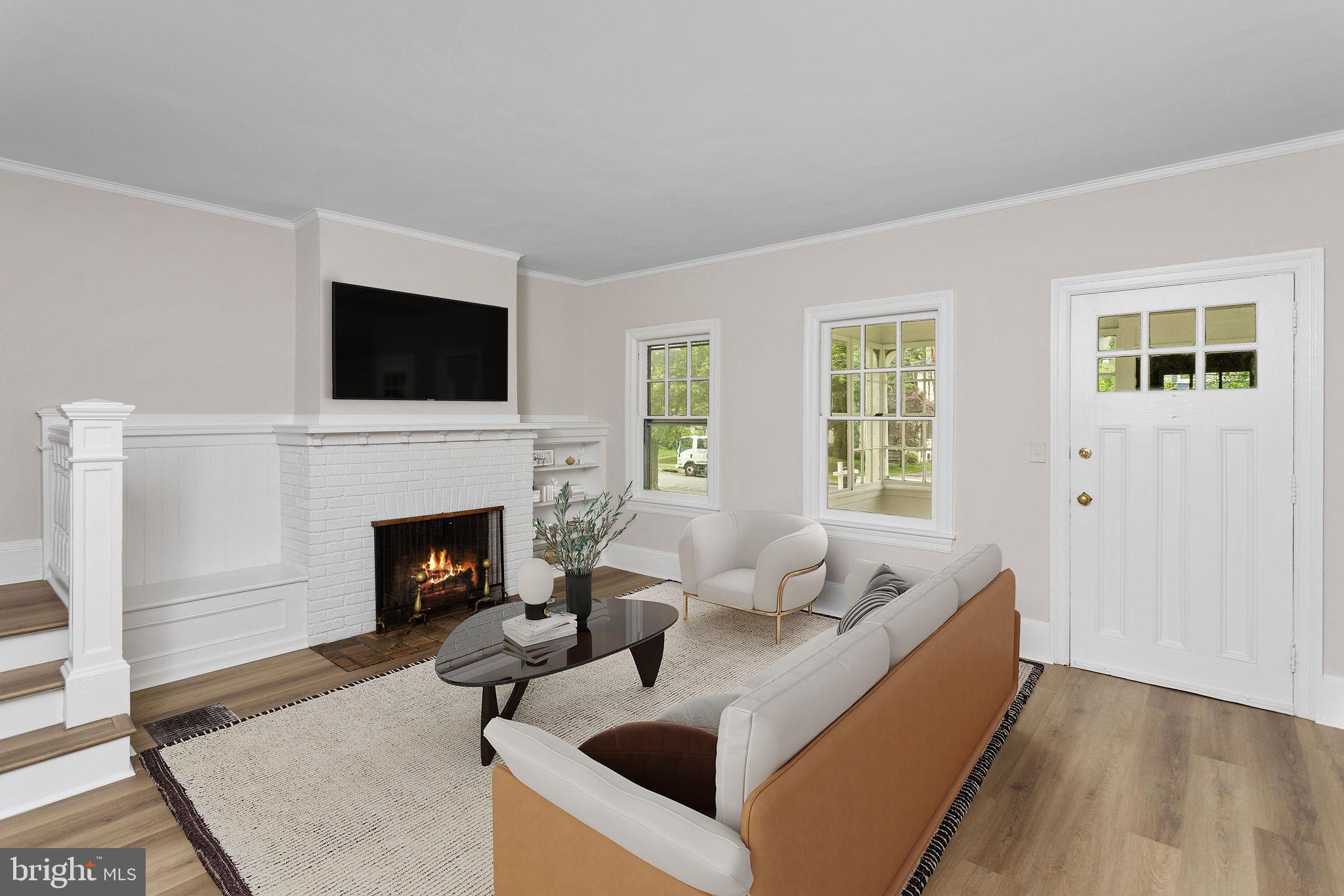 26 Jefferson Road Princeton, NJ 08540 - Photo 6 of 32 a living room with furniture a flat screen tv and a fireplace