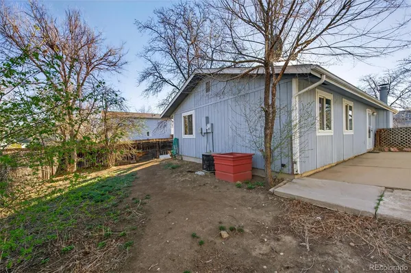 a house that has a tree in front of it