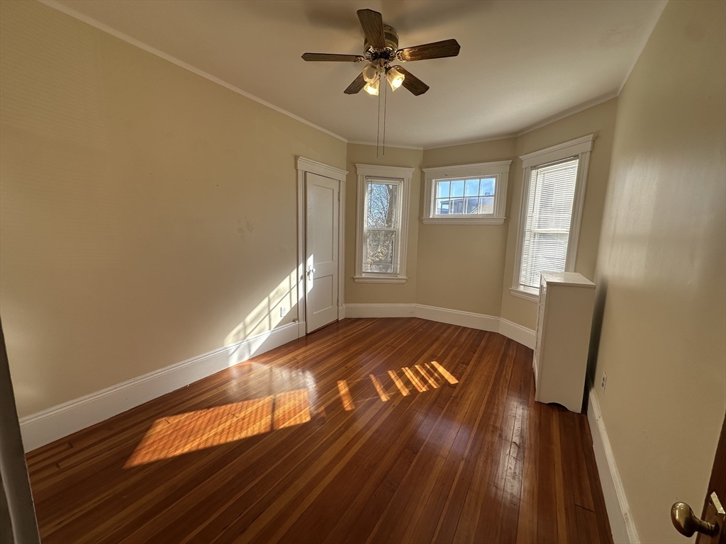 17 Manley Street, Unit 2 Boston, MA 02122 - Photo 12 of 16 a view of empty room with wooden floor