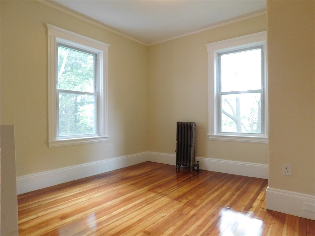 17 Manley Street, Unit 2 Boston, MA 02122 - Photo 14 of 16 a view of empty room with wooden floor and fan
