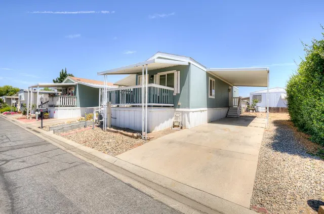 a front view of a house with a patio