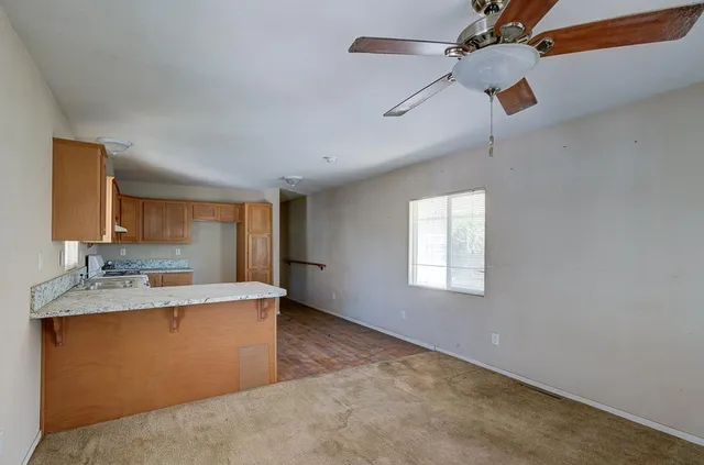 a view of a kitchen with a sink and cabinet area