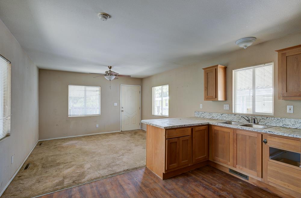 1218 East Cleveland Avenue, Unit 86 Madera, CA 93638 - Photo 8 of 14 a view of a kitchen with sink and window