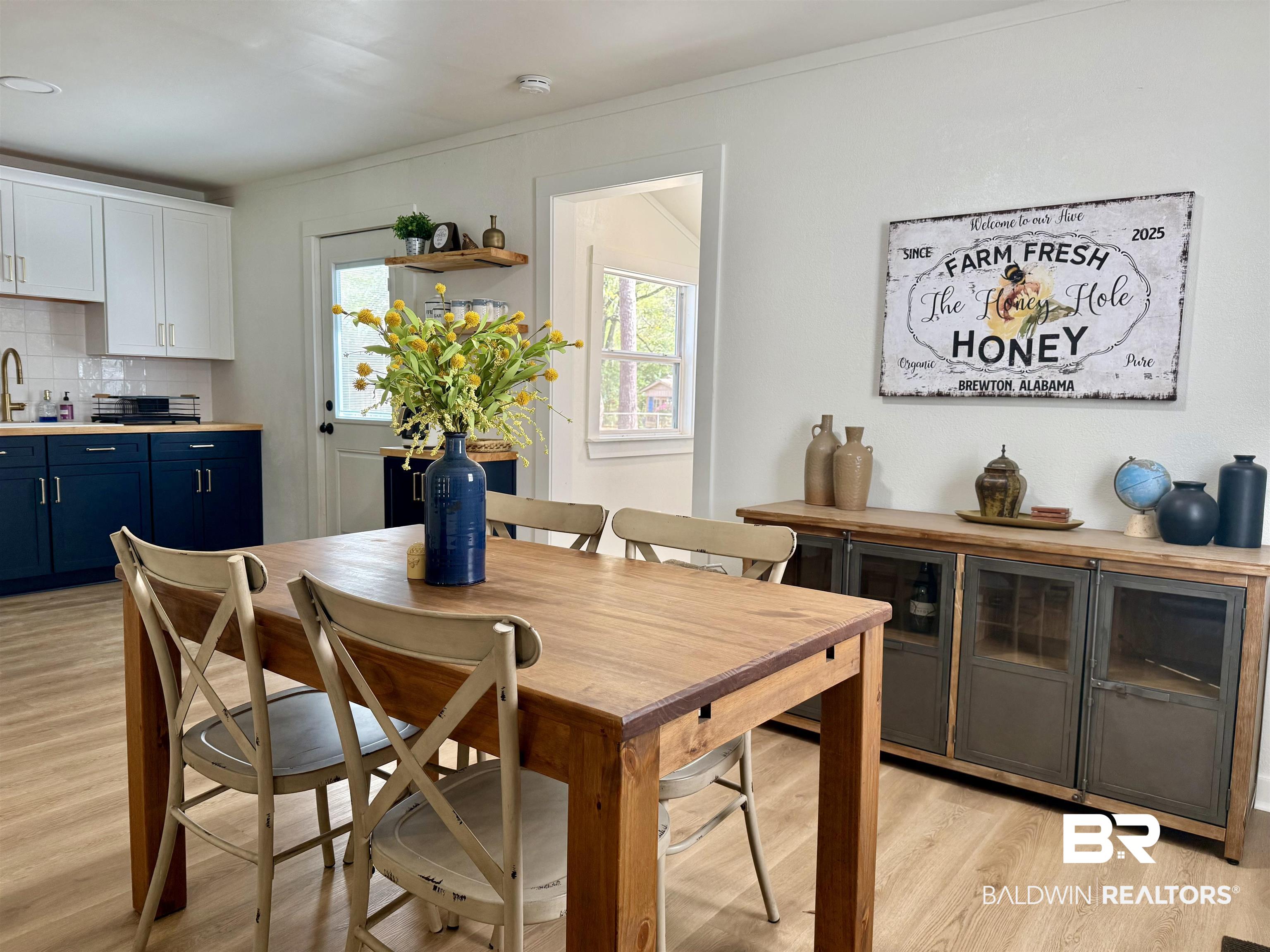 107 Dawson Street Brewton, AL 36426 - Photo 2 of 15 Dining space featuring light wood finished floors and ornamental molding