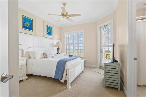 a bed room with a bed and a chandelier