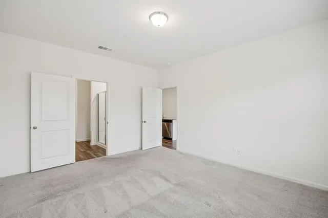 a bathroom with a double vanity sink and mirror